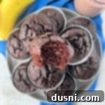 Close up view of Chocolate Banana muffins stacked on a serving plate.