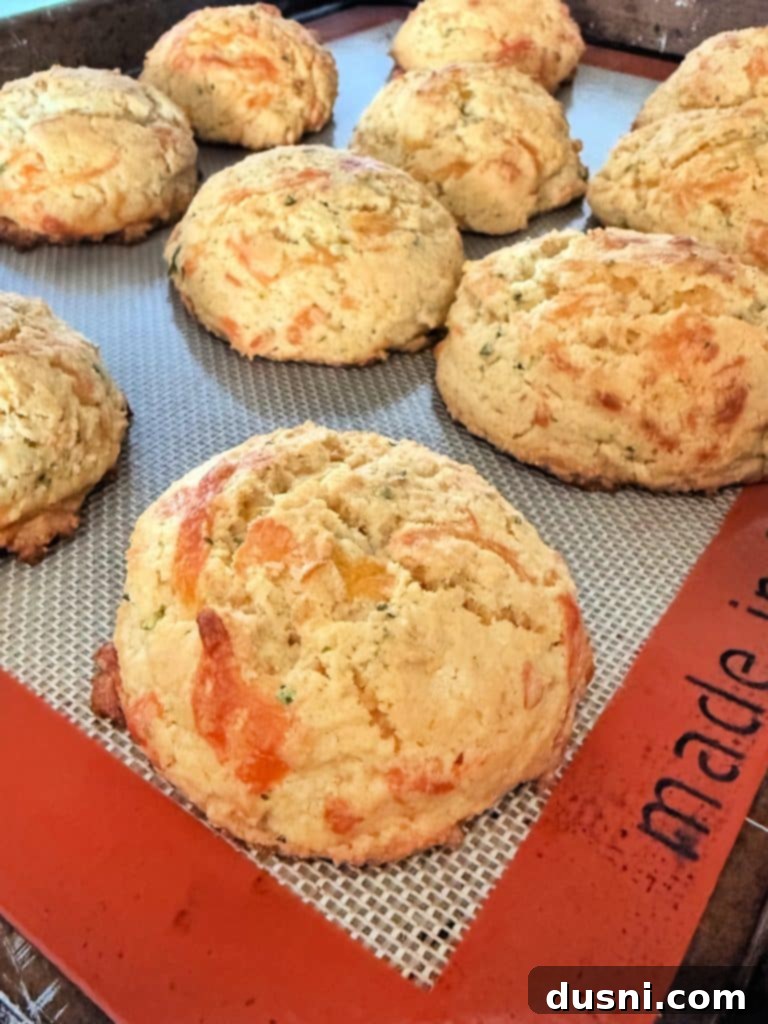 Dorothys Golden Cornbread Drops 8 A baking sheet filled with perfectly scooped, unbaked cornbread drop biscuits, ready for the oven.