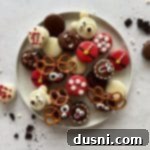 Overhead of Christmas Oreos on a white plate.