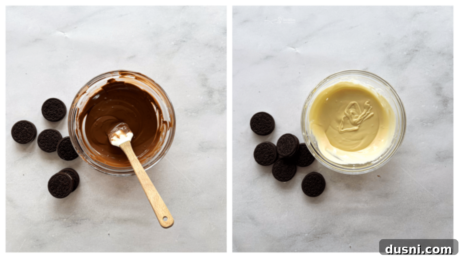 Overhead view of a hand dipping an Oreo cookie into a bowl of melted white chocolate, with other decorated Oreos on a baking sheet in the background.