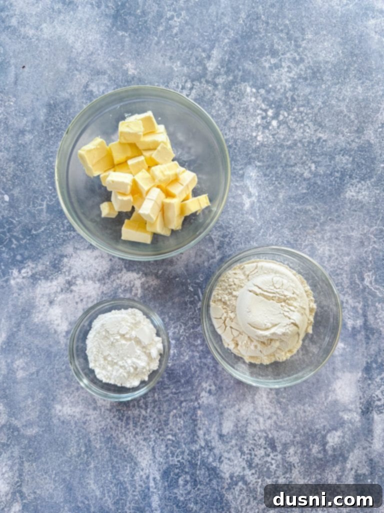 Crimson & Cacao Dream Bars 6 Ingredients for Double Chocolate Cranberry Magic Bars laid out on a baking sheet, ready for assembly.