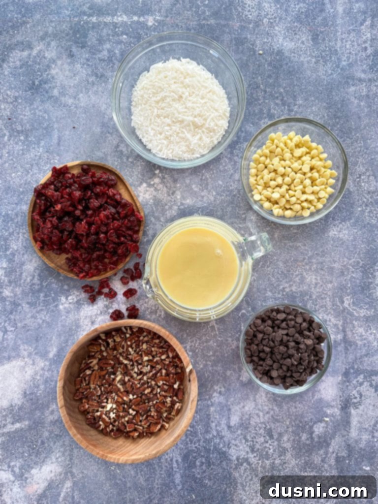 Crimson & Cacao Dream Bars 7 Hands pressing the shortbread crust into a baking pan for the magic bars.