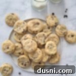 Soft & Chewy Chocolate Chip Sugar Cookies 17 Overhead of Chocolate Chip Sugar Cookies and 2 glasses of milk