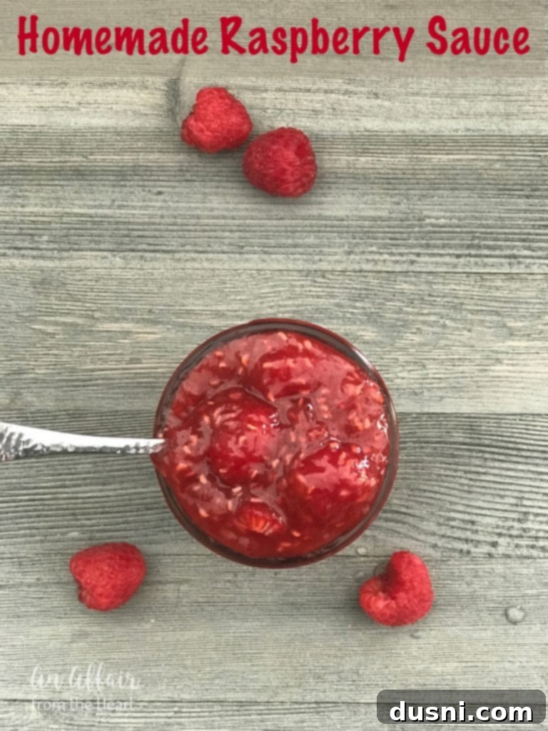 Jars of Homemade Raspberry Sauce Ready for Storage