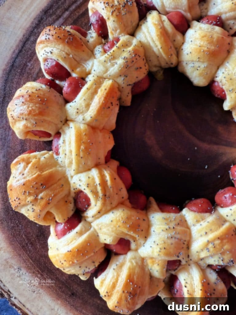 Pull-Apart Pigs in a Blanket Wreath 11 The baked Pigs in a Blanket Wreath, golden brown and perfectly puffed, fresh out of the oven.