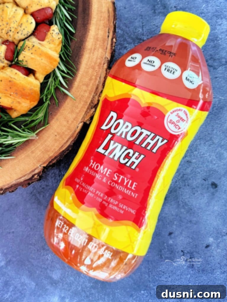 Pull-Apart Pigs in a Blanket Wreath 15 Bottle of Dorothy Lynch Dressing positioned artfully on a rustic wooden background, highlighting its iconic label.
