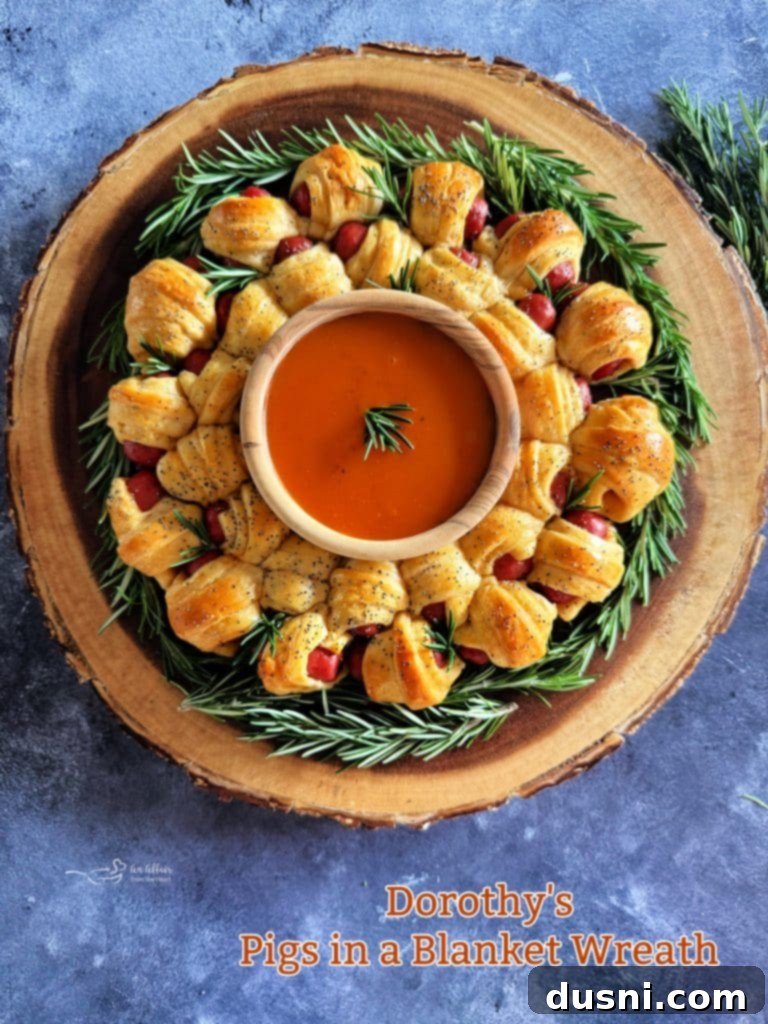 Pull-Apart Pigs in a Blanket Wreath 17 Beautifully presented Pigs in a Blanket Wreath with a close-up of the delicious golden crescent rolls and sausages, ready for enjoyment.