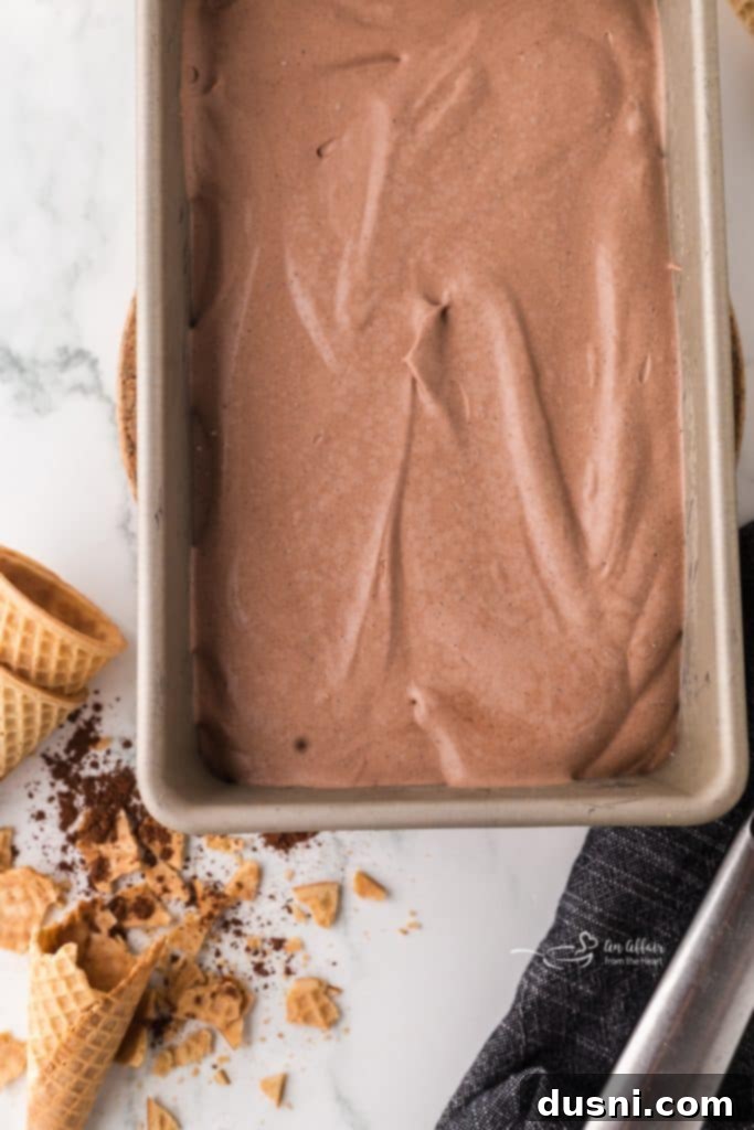 Ice cream mixture poured into a loaf pan, ready for freezing.