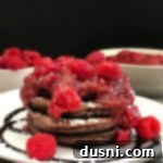 Side view of Fluffy Chocolate Pancakes with Raspberry Sauce
