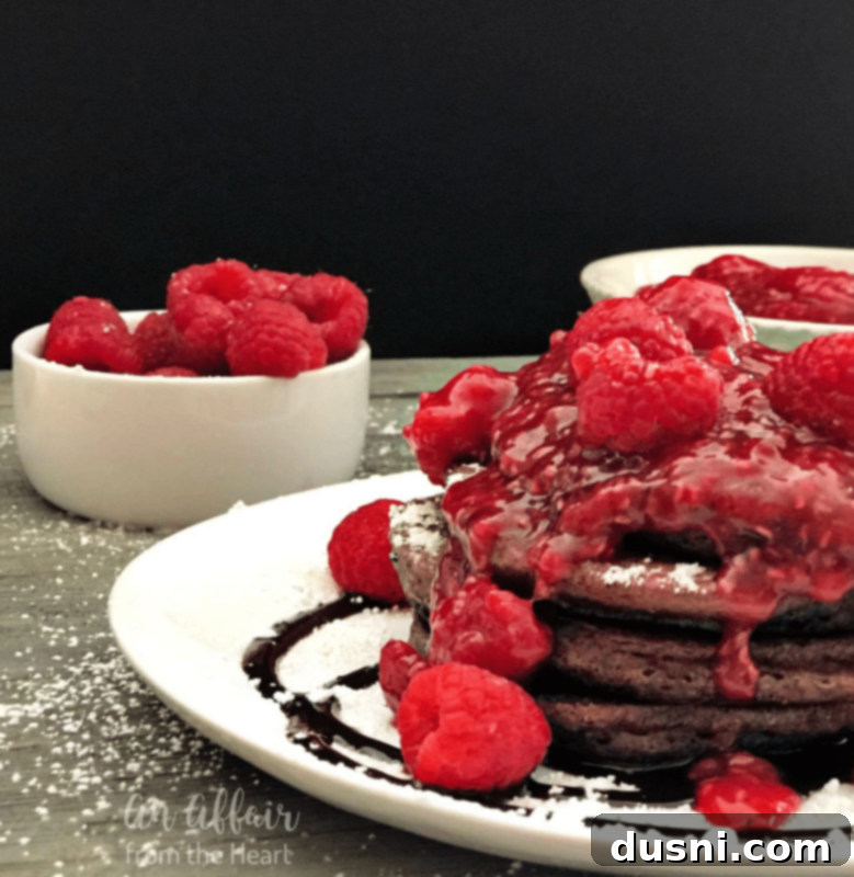 Stack of Chocolate Pancakes with Raspberry Drizzle