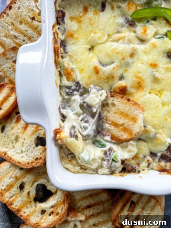 cheesy philly cheese steak dip in white dish
