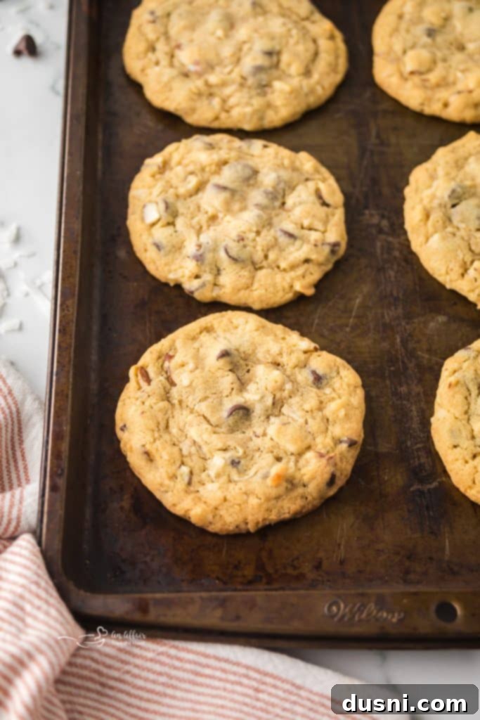 Freshly baked Almond Joy Cookies on a baking sheet