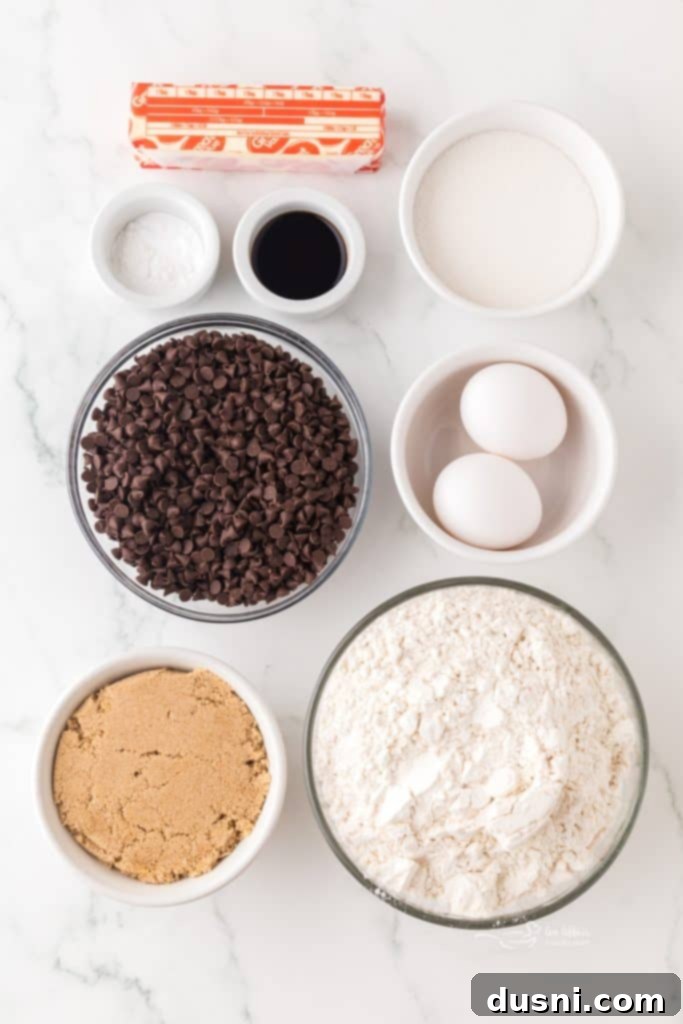 Tiny Chocolate Chip Delights 6 Hand reaching for a perfect mini chocolate chip cookie.