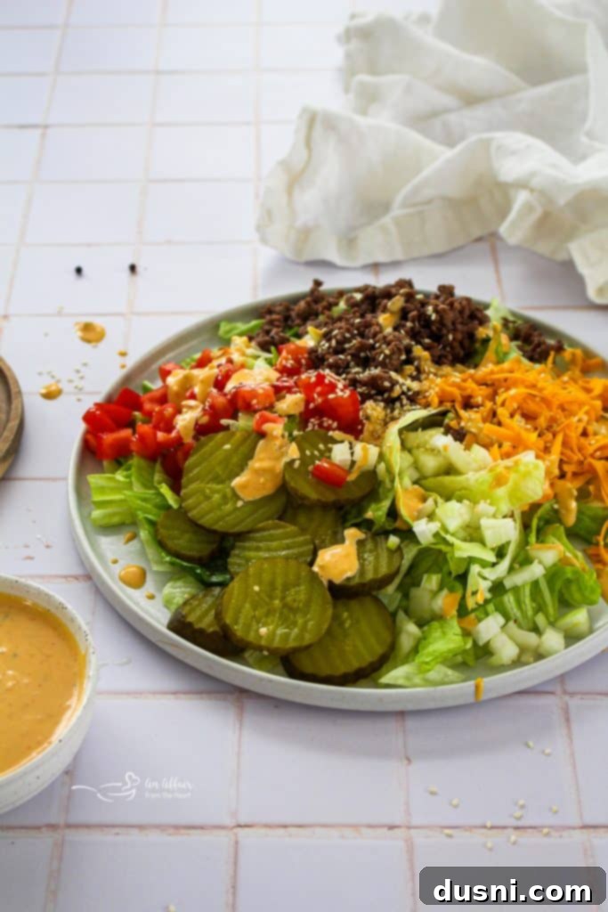 Big Mac Salad with ingredients and serving on a plate.