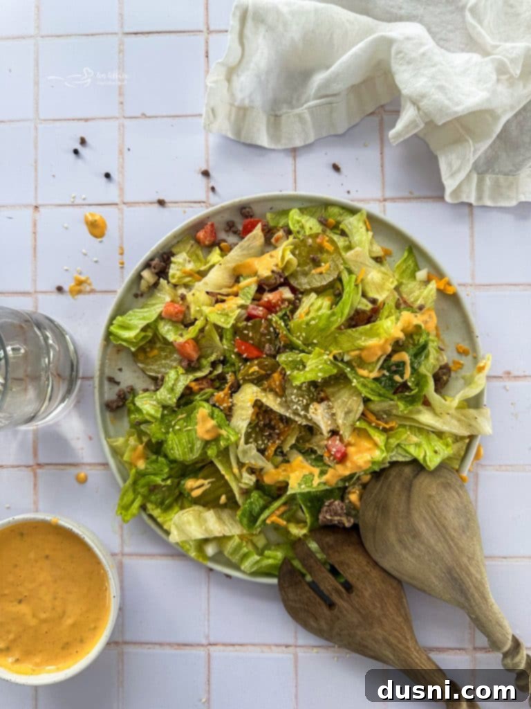 Big Mac Salad with ingredients displayed next to it.