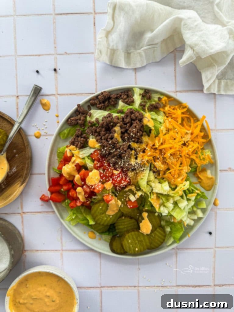 Assembling a Big Mac Salad in a large bowl.