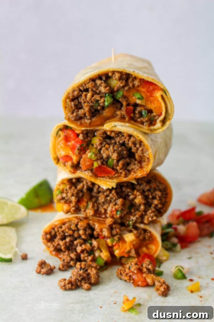 Close up of a homemade Taco Bell Meximelt, showing the fillings spilling out.