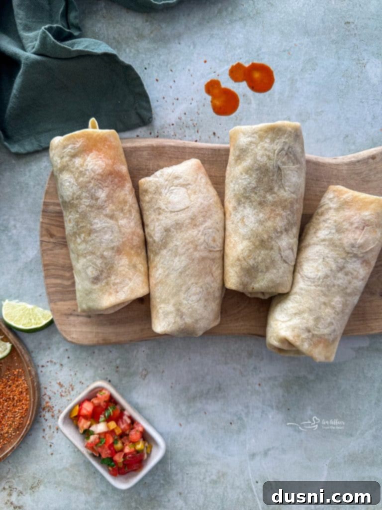 A plate of two homemade Meximelts, one bitten into to show the interior.