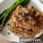 Close up of No Peek Pork Chops and Mushrooms on rice.