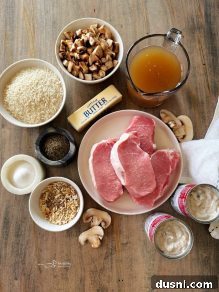 No Peek Pork Chops and Rice cooking in a cast iron skillet.