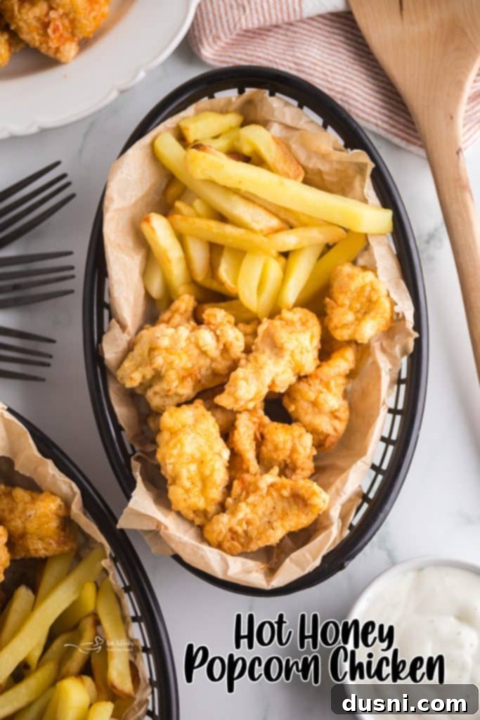 Hot Honey Glazed Crispy Popcorn Chicken 12 Hot Honey Popcorn Chicken served in a small basket