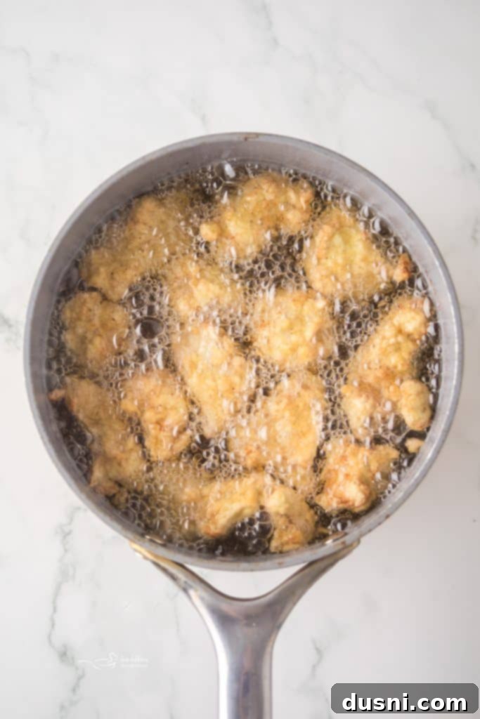 Hot Honey Glazed Crispy Popcorn Chicken 7 Chicken dipped in egg wash