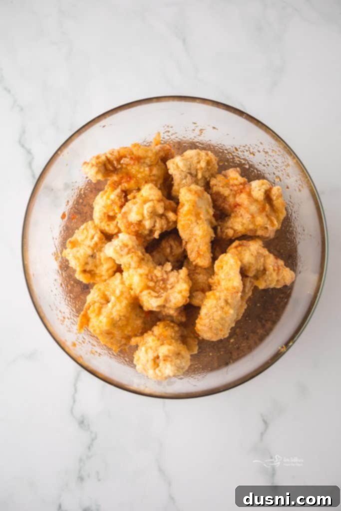 Hot Honey Glazed Crispy Popcorn Chicken 8 Frying chicken in hot oil