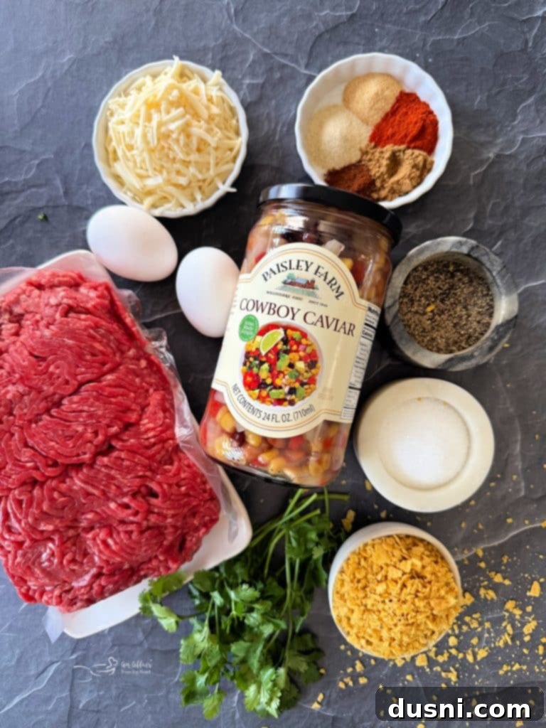 Mexican Street Burgers 6 Three Mexican hamburgers stacked on a plate with fresh ingredients.