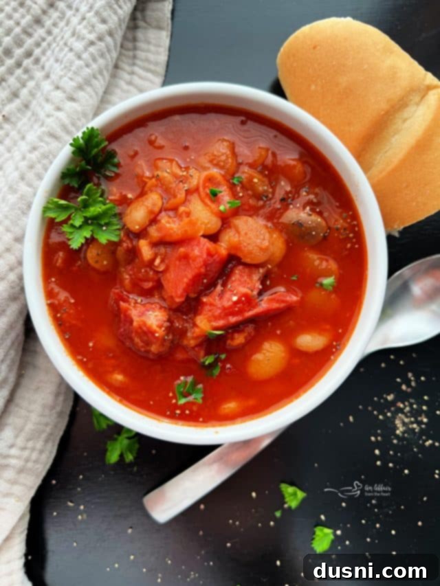 Hearty Black Bean Soup Made Simple 12 Instant Pot Ham and Bean Soup in a white bowl