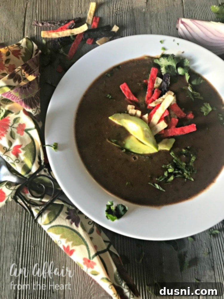 Hearty Black Bean Soup Made Simple 16 Black Bean Soup in a bowl garnished with cilantro.