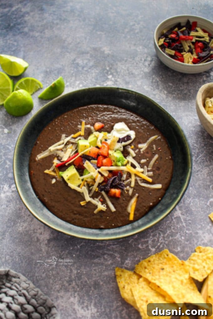 Hearty Black Bean Soup Made Simple 4 A bowl of thick, dark black bean soup, ready for garnishing.