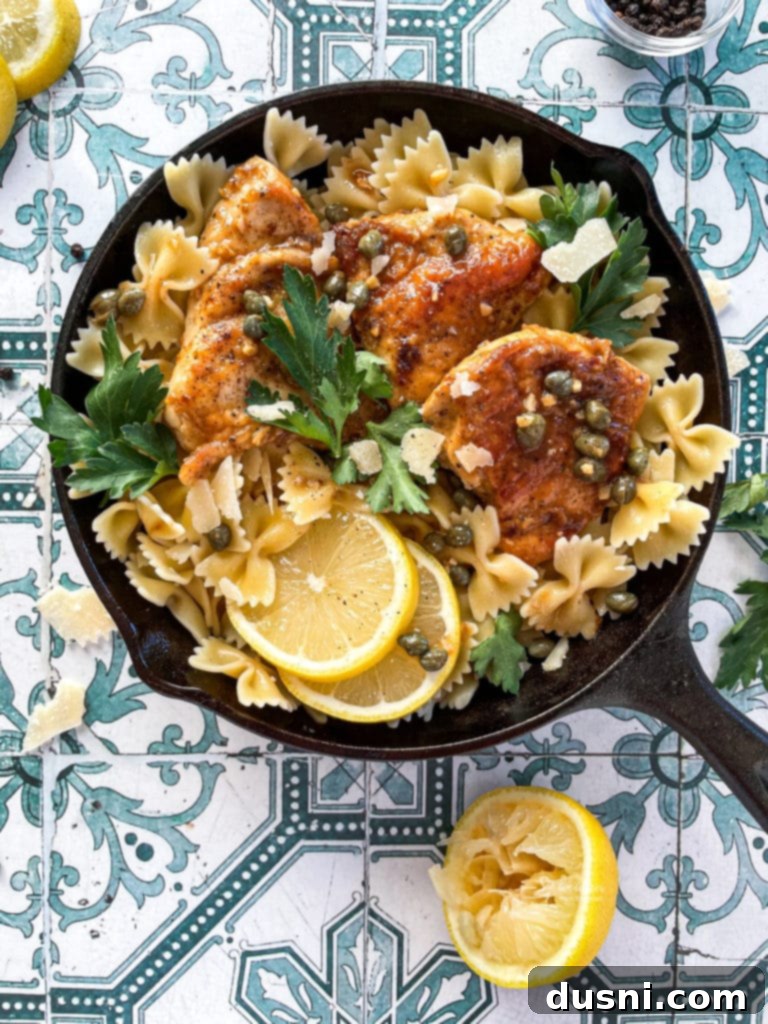 overhead of chicken piccata in a pan