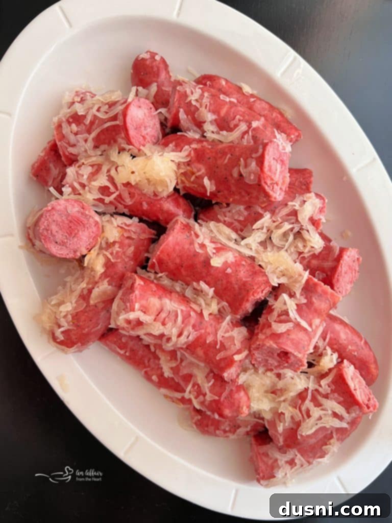 Polish Sausage & Sauerkraut in a white serving dish