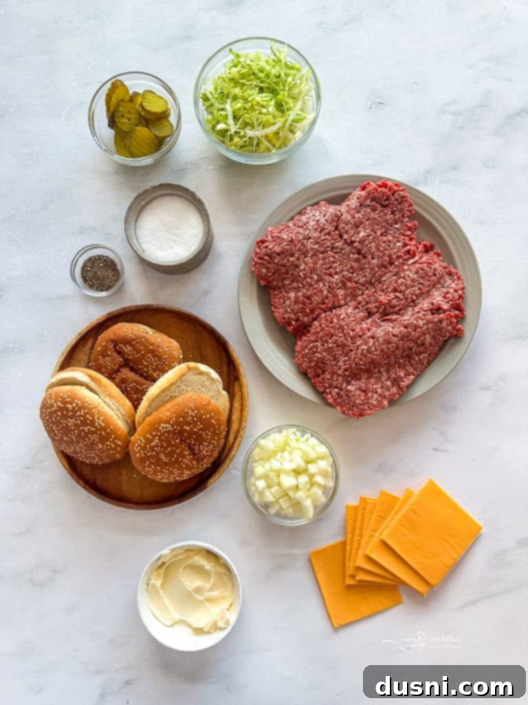 Fresh ingredients for the Big Mac burger laid out: ground beef, buns, lettuce, pickles, and cheese.