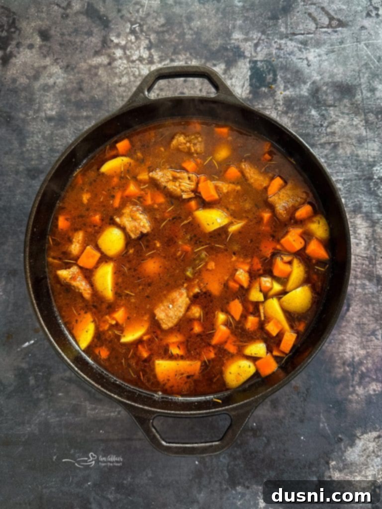 Hearty Pork Stew 12 Carrots and potatoes added to the simmering pork stew.