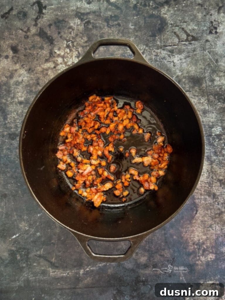 Hearty Pork Stew 8 Raw thick-cut bacon, diced, in a Dutch oven.