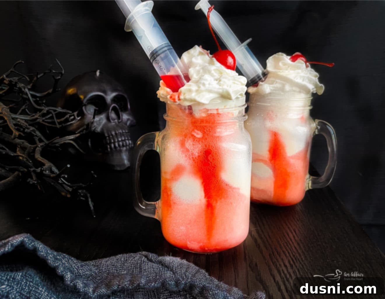 Mystic Doll Pastries 13 Two Bloody Dirty Shirley Floats with syringe decorations, perfect for Halloween.