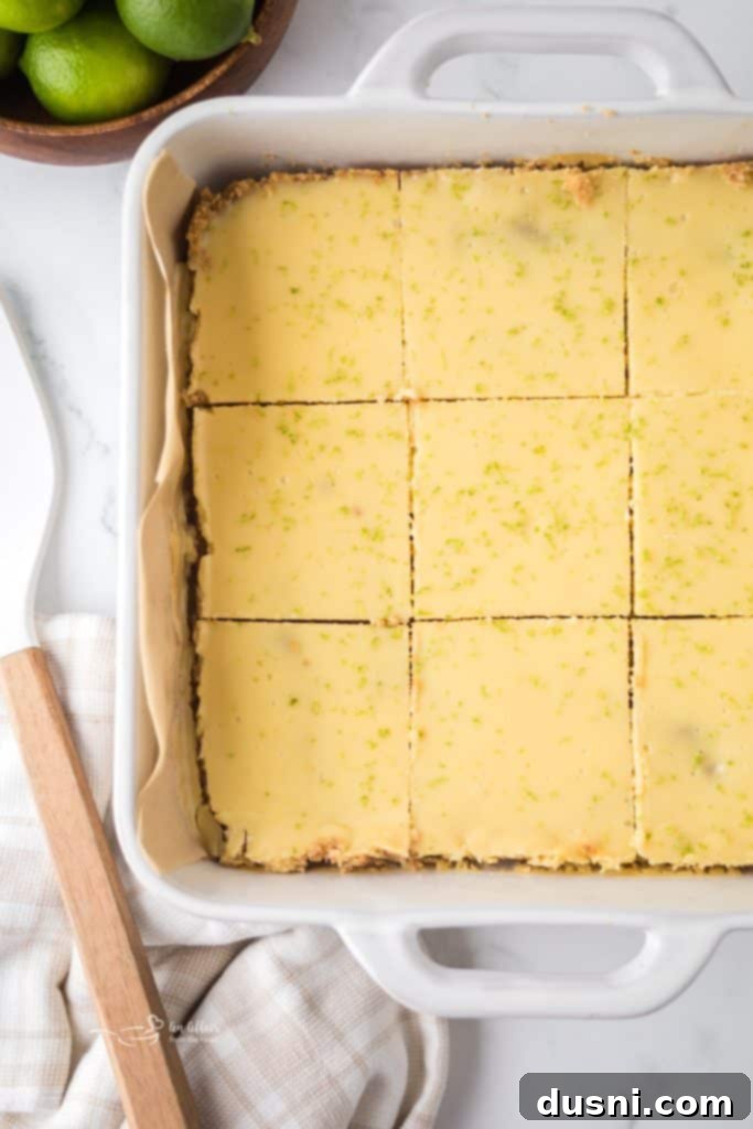 Zesty Key Lime Pie Bars 11 Baked Key Lime Pie Bars cooling in the pan.