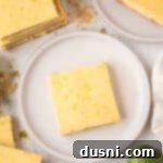 Zesty Key Lime Pie Bars 18 A Key Lime Pie Bar on a white plate.