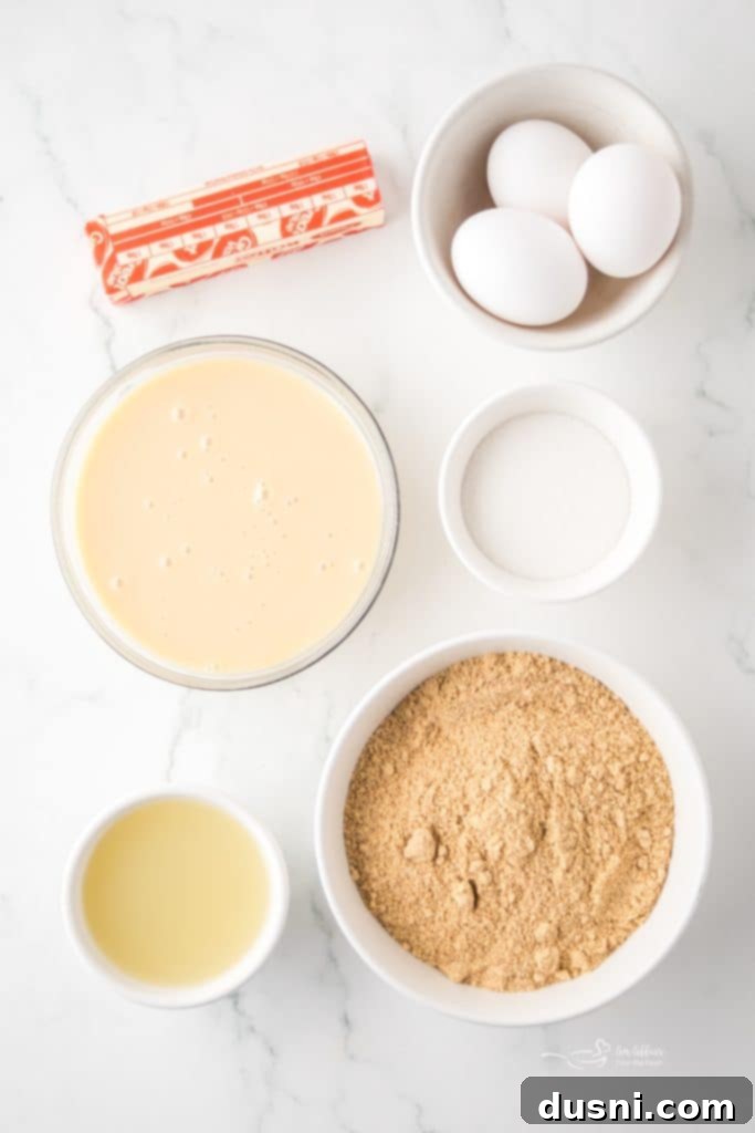 Zesty Key Lime Pie Bars 5 Several Key Lime Pie Bars arranged on a light blue plate, garnished with lime zest.