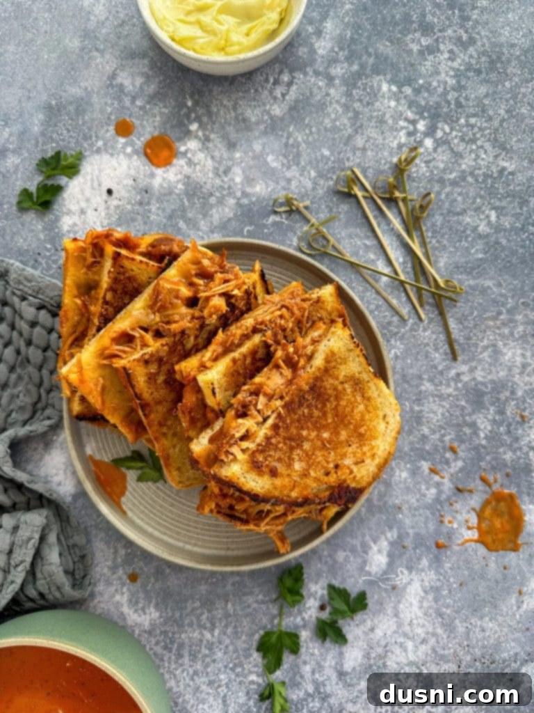 Ingredients for BBQ Pulled Pork Grilled Cheese: shredded pork, cheese slices, sourdough bread, and butter.