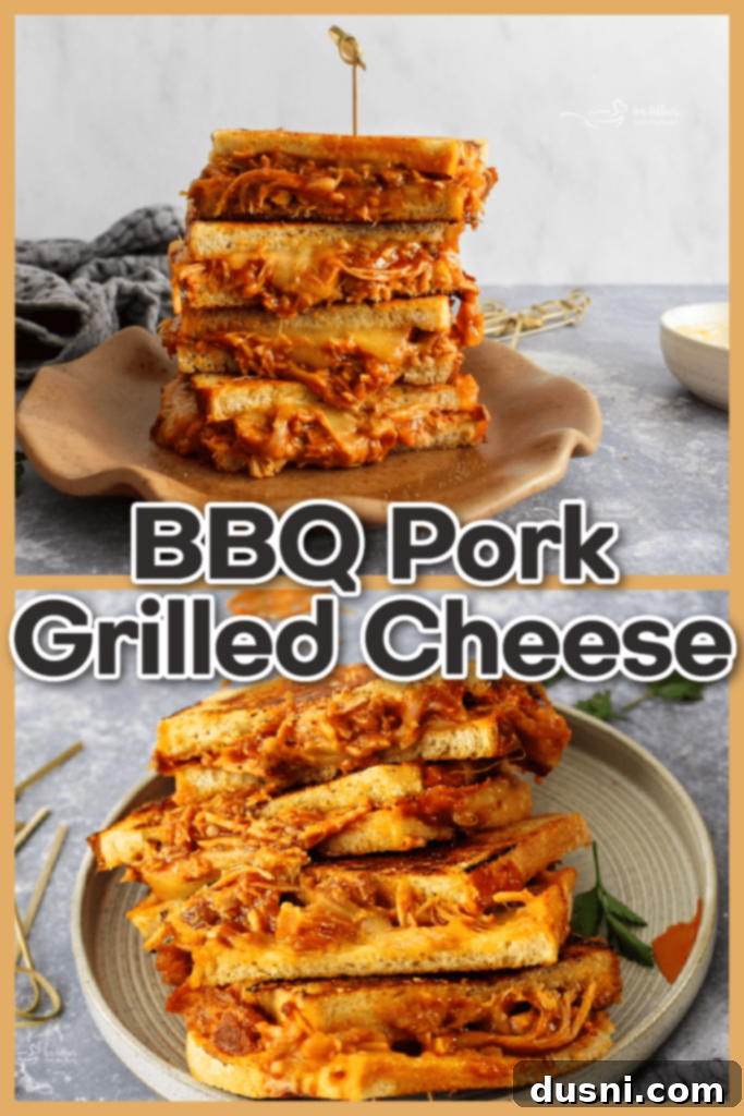 A perfectly grilled BBQ Pulled Pork Grilled Cheese sandwich, sliced in half, showing rich melted cheese and pork.