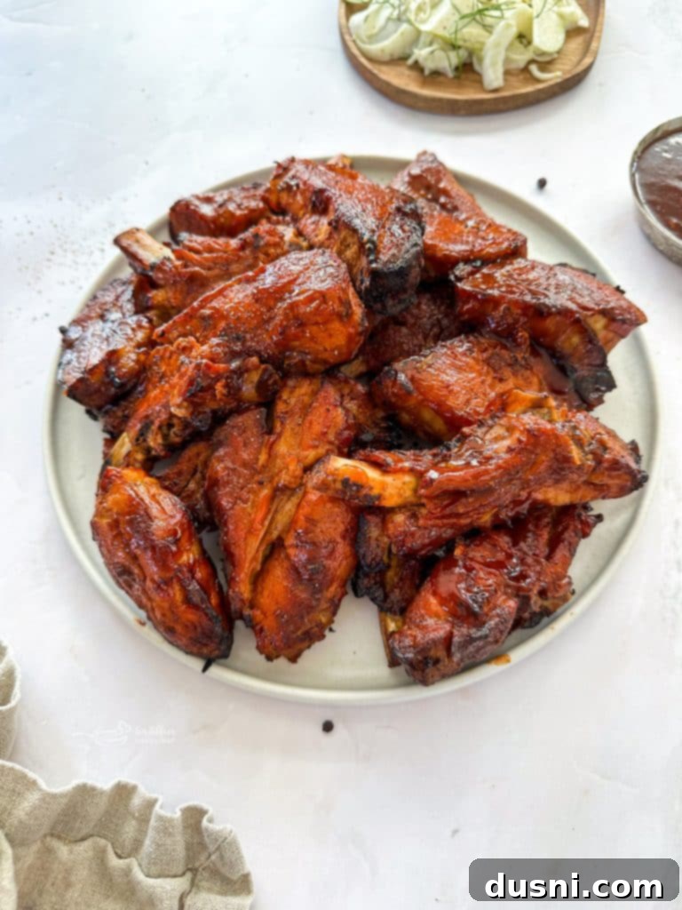 Close up of Slow cooker Dr. Pepper Ribs on a white plate, another great BBQ recipe.