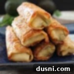 close up of stacked Guacamole Egg Rolls with Spicy Cilantro Ranch Dipping Sauce