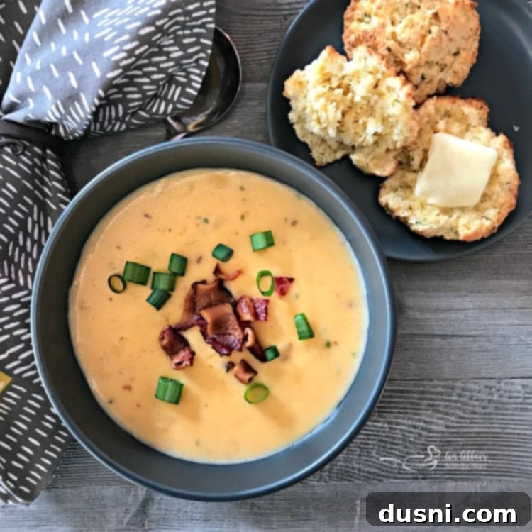 Cheesy Cornbread Drop Biscuits served with a bowl of potato soup