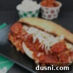Instant Pot Twisted Meatball Subs on a blue plate