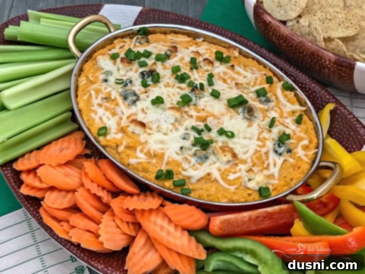Spicy Buffalo Cauliflower Dip 10 Warm Buffalo Cauliflower Dip with fresh vegetable sticks and tortilla chips