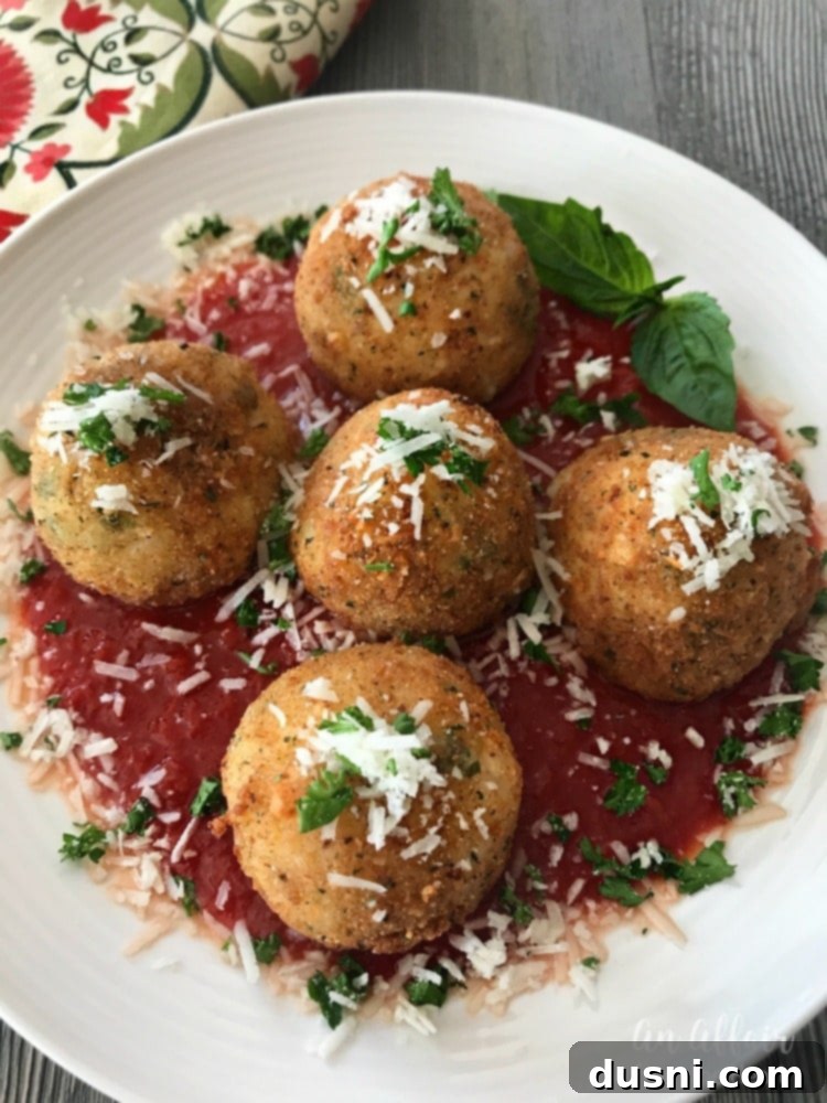 Arancini - Three Cheese Fried Risotto Balls, perfectly golden and ready to serve