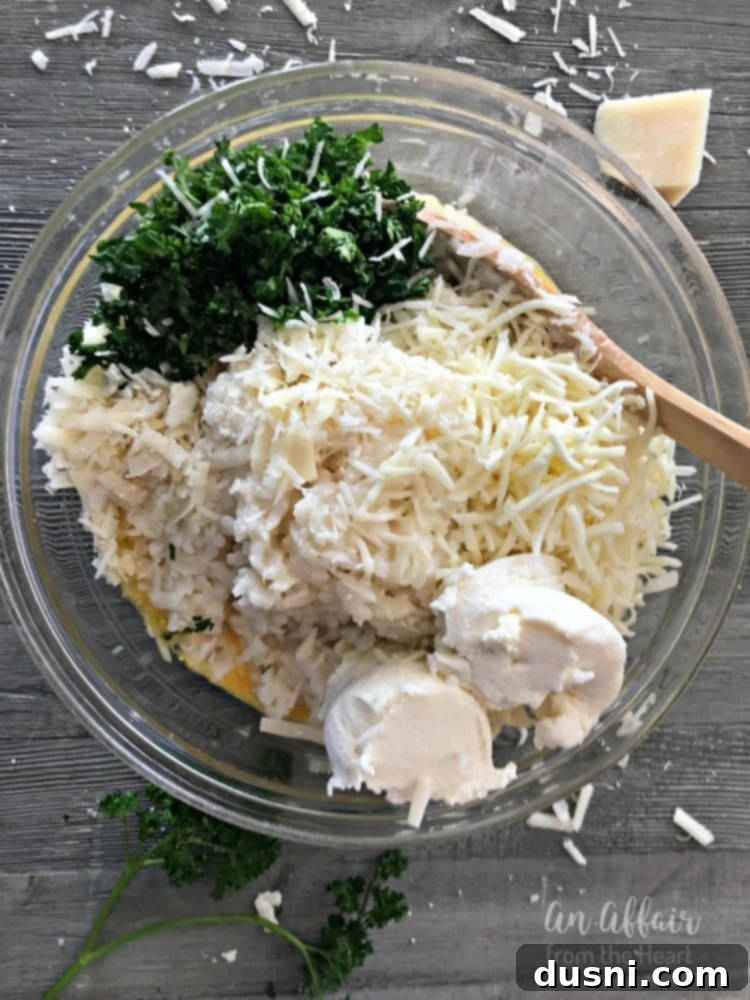Mixing Arancini ingredients: rice, eggs, cheeses, parsley, salt