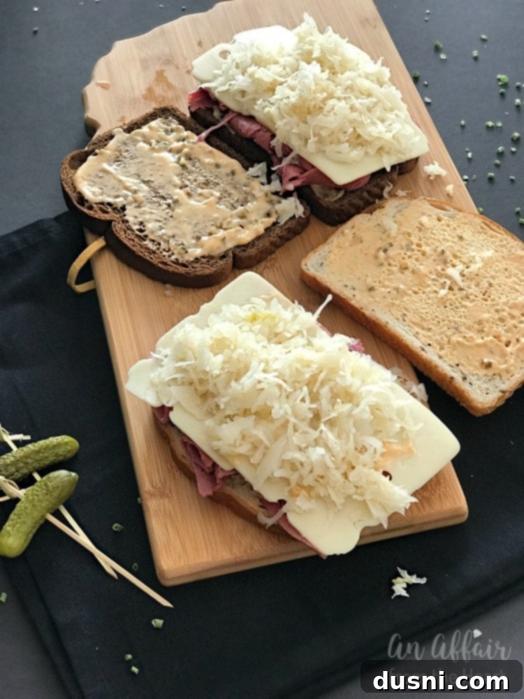 The Legendary Reuben 11 Adding Frank's Kraut to a Reuben sandwich